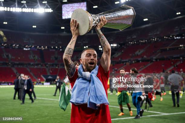 Alejandro Gomez lifts the trophy after the award ceremony following the UEFA Europa League final football match between Sevilla FC and AS Roma....