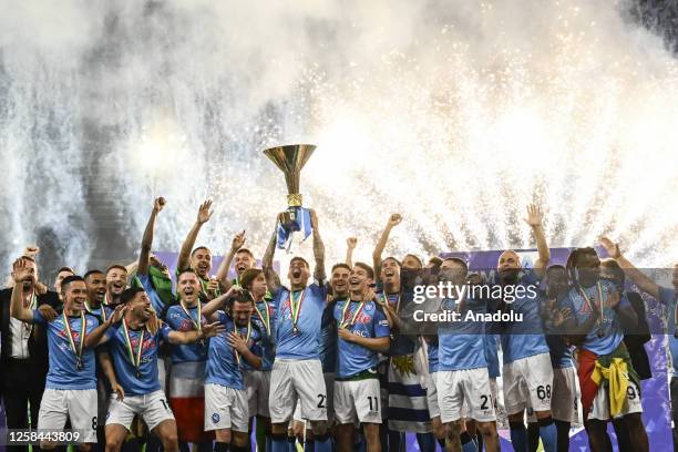 Players of Napoli, hold up the trophy of the Scudetto as winner of the championship at the end of the Italian Serie A football match between Napoli...