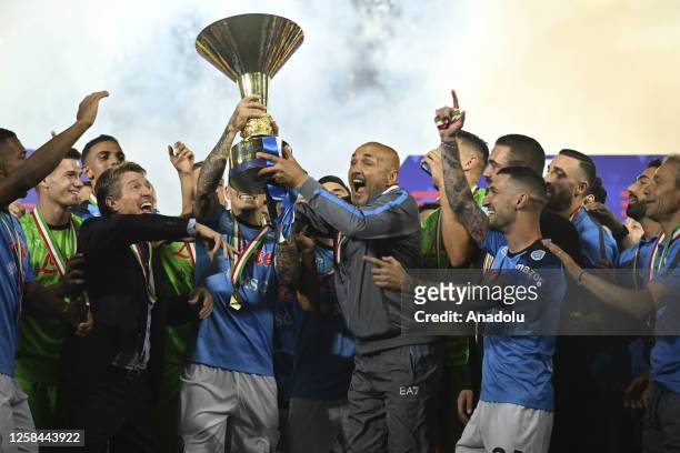 Players of Napoli, hold up the trophy of the Scudetto as winner of the championship at the end of the Italian Serie A football match between Napoli...