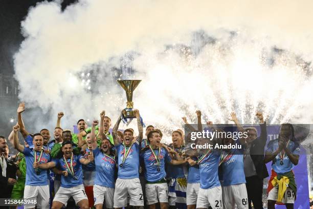 Players of Napoli, hold up the trophy of the Scudetto as winner of the championship at the end of the Italian Serie A football match between Napoli...