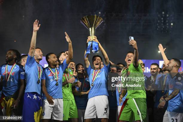 Players of Napoli, hold up the trophy of the Scudetto as winner of the championship at the end of the Italian Serie A football match between Napoli...