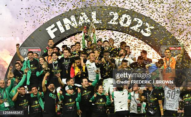 Club Leon of Mexico players celebrate with the championship trophy after Leon defeated LAFC 1-0 in their second leg of the CONCACAF SCCL Final match...