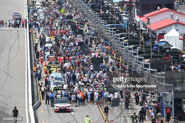 Fans crowd around the cars on pit road before the start of the NASCAR Cup Series Enjoy Illinois 300 on June 04 at World Wide Technology Raceway, in...