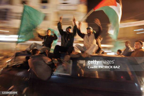 Hamas supporters parade the streets of Gaza City with national and Islamic flags in celebration late 26 January 2006 as the Islamic Resistance...