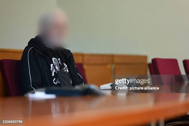 June 2023, Lower Saxony, Aurich: The 82-year-old defendant sits in room 116 of the Aurich Regional Court, where a trial for drug trafficking is being...