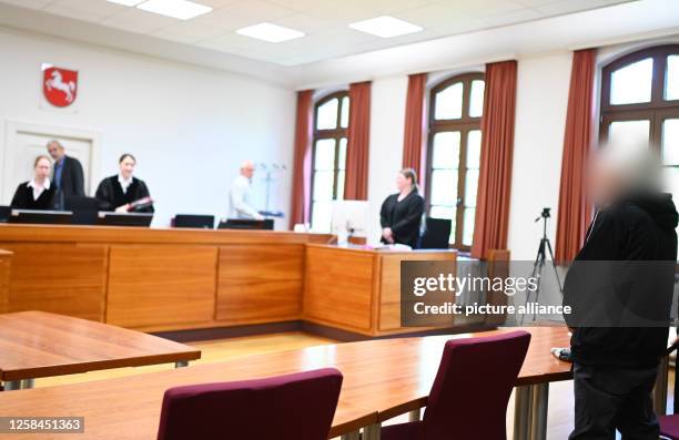 June 2023, Lower Saxony, Aurich: The 82-year-old defendant stands in room 116 of Aurich Regional Court, where a trial for drug trafficking is being...