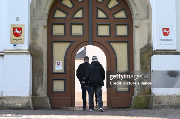 June 2023, Lower Saxony, Aurich: The 82-year-old defendant enters the main entrance to Aurich District Court, where a drug trafficking trial is being...