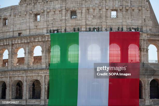 The Colosseum adorned by the Fire Brigade with a large Italian flag to celebrate the 78th Italian Republic Day. Parade in via dei Fori Imperiali for...