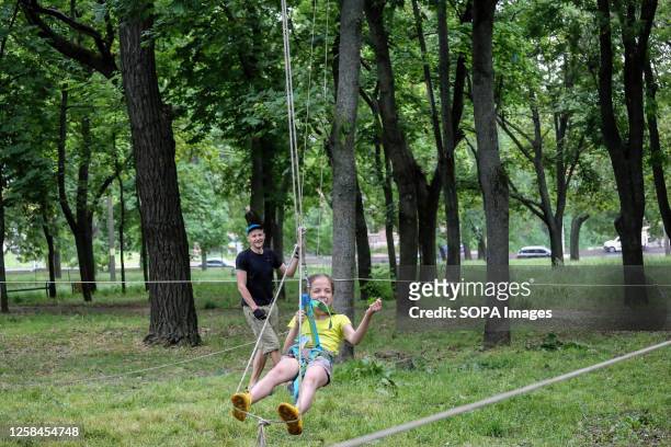 Children are seen bungee riding in Gamow Square during the Children's Day. Odessa People's Church organised an event on World Children's Day in Gamow...