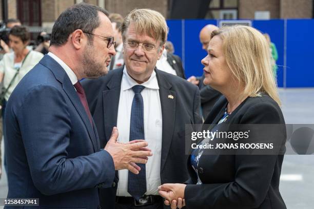 Justice Minister Vincent Van Quickenborne, German ambassador to Belgium Martin Kotthaus and German interior minister Nancy Faeser pictured ahead of a...