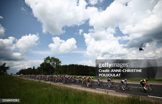 The pack rides during the second stage of the 75th edition of the Criterium du Dauphine cycling race 3 kms betwenn Brassac-les-Mines and La...