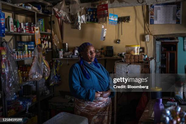 Shop owner waits for customers during a loadshedding period in a mini-market in the township of Namahadi, Frankfort, South Africa, on Saturday, June...