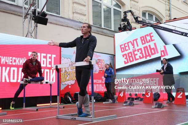 Russian hurdler Sergey Shubenkov warms up for the 60m hurdles event of the Athletics Week local track and field tournament at the central Nikolskaya...