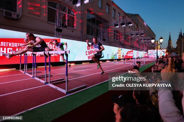 Russian hurdler Sergey Shubenkov competes in the 60m hurdles event of the Athletics Week local track and field tournament at the central Nikolskaya...