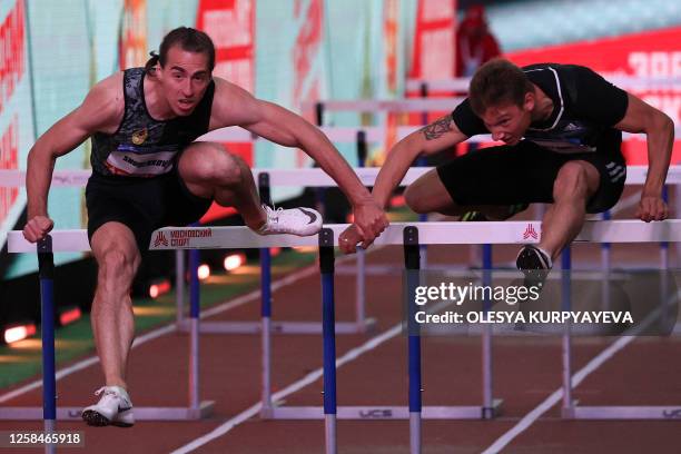 Russian hurdler Sergey Shubenkov competes in the 60m hurdles event of the Athletics Week local track and field tournament at the central Nikolskaya...