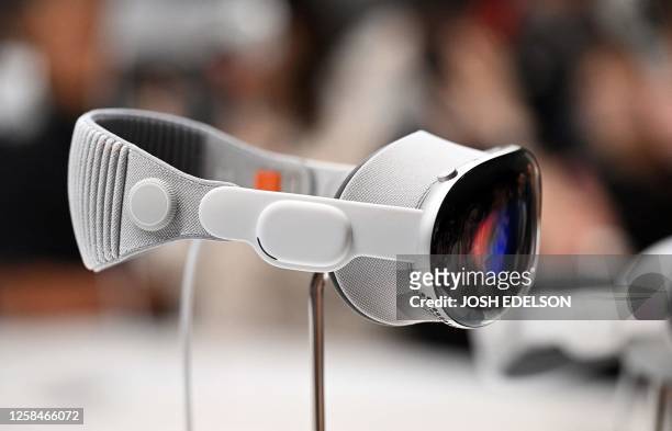 Apple's new Vision Pro virtual reality headset is displayed during Apple's Worldwide Developers Conference at the Apple Park campus in Cupertino,...