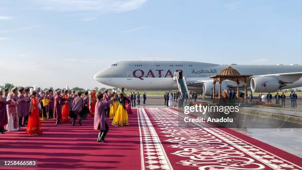 Dancers perform during the welcoming ceremony for the Emir of Qatar Sheikh Tamim ibn Hamad Al Thani at Samarkand International Airport in Tashkent,...