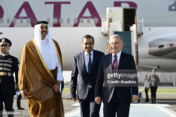 President of Uzbekistan Shavkat Mirziyoyev welcomes the Emir of Qatar Sheikh Tamim ibn Hamad Al Thani at Samarkand International Airport in Tashkent,...
