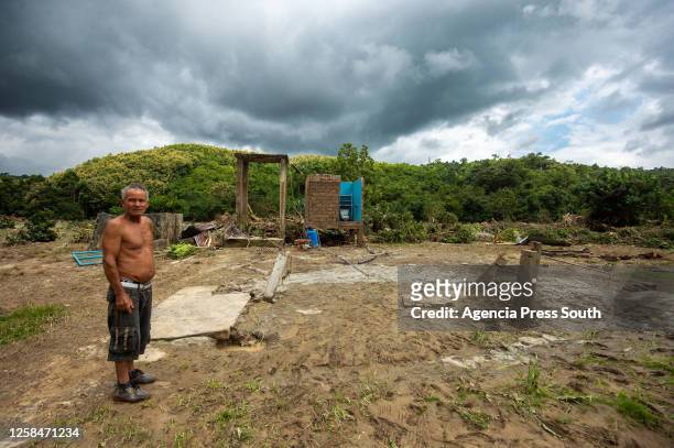 Person looks on after losing all his belongings due to the overflow of the Teaone River on June 5, 2023 in Tabiazo, Esmeraldas, Ecuador. Six rivers...