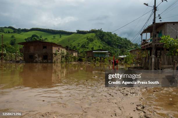 People recover their belongings after the overflow of the Teaone River on June 5, 2023 in Esmeraldas, Ecuador. Six rivers in the Esmeraldas region...