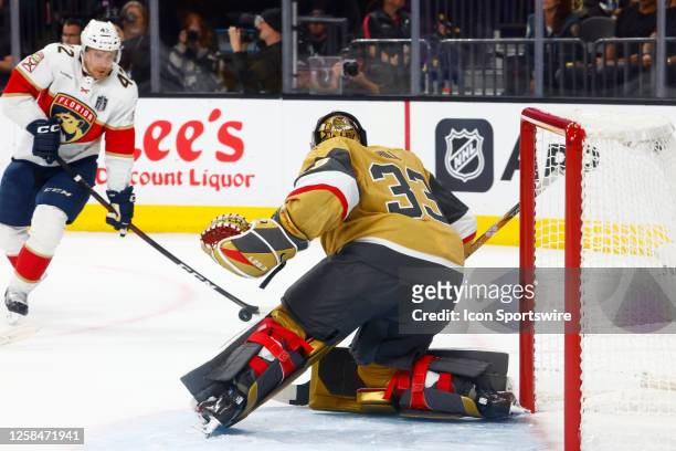 Adin Hill of the Vegas Golden Knights looks to block the shot of Gustav Forsling of the Florida Panthers during Game Two of the NHL Stanley Cup Final...