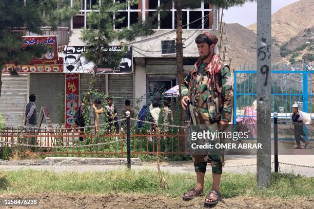 Member of Taliban stands guard near the site of a suicide attack in Faizabad district of Badakhshan province on June 6, 2023. The acting governor of...