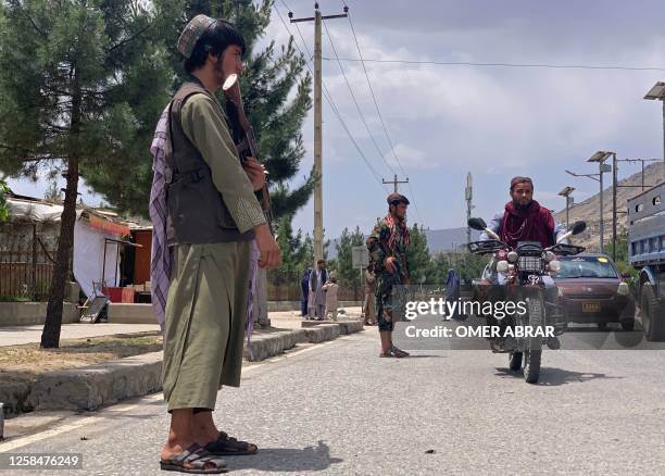 Member of Taliban stands guard near the site of a suicide attack in Faizabad district of Badakhshan province on June 6, 2023. The acting governor of...