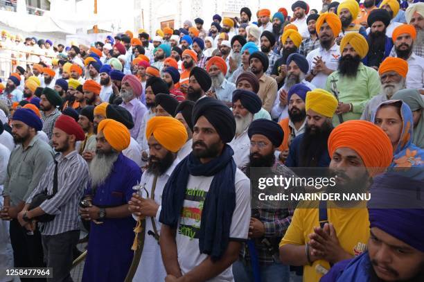 Activists from various Sikh organisations offer prayers at the Golden Temple on the occasion of the 39th anniversary of Operation Blue Star, in...