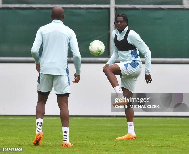 West Ham United's English midfielder Michail Antonio juggles with a ball during a training session on the eve of the UEFA Europa Conference League...