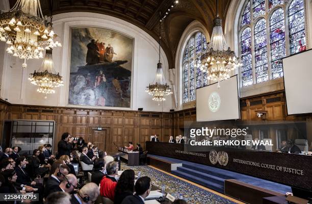 This general view shows President of The International Court of Justice Joan Donoghue as she addresses the court including Russian and Ukrainian...