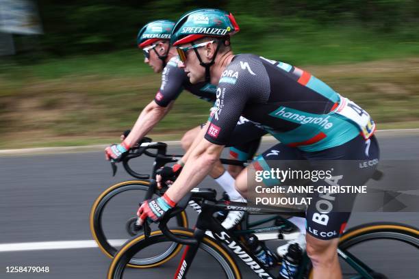 Hansgrohe' BORA Australian rider Jai Hindley rides in the pack during the third stage of the 75th edition of the Criterium du Dauphine cycling race 5...