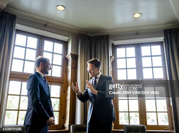 Netherlands' Prime Minister Mark Rutte welcomes Prime Minister of the German state of Saxony Michael Kretschmer prior to a meeting at the Ministry of...