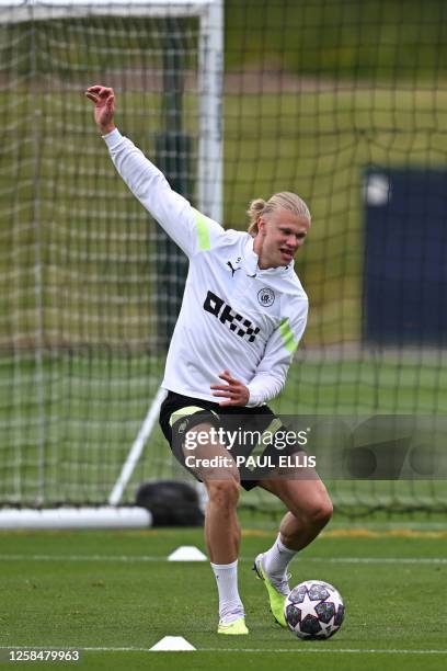 Manchester City's Norwegian striker Erling Haaland takes part in a team training session at Manchester City training ground in Manchester, north-west...