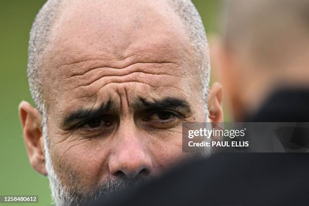 Manchester City's Spanish manager Pep Guardiola takes part in a team training session at Manchester City training ground in Manchester, north-west...