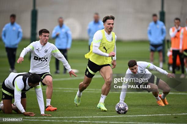 Manchester City's English midfielder Jack Grealish takes part in a team training session at Manchester City training ground in Manchester, north-west...