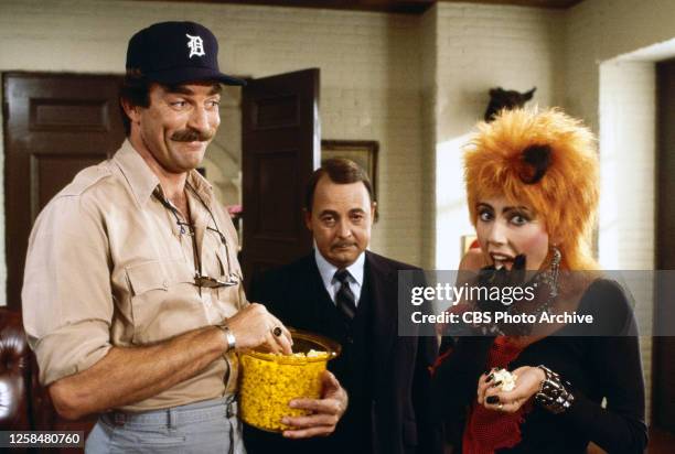 Magnum, P.I. . A CBS television detective drama series. Episode, "Professor Jonathan Higgins," January 10, 1985. Pictured from left is Tom Selleck ,...