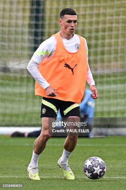 Manchester City's English midfielder Phil Foden takes part in a team training session at Manchester City training ground in Manchester, north-west...