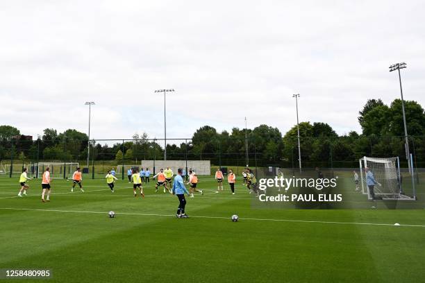 Manchester City's players take part in a team training session at Manchester City training ground in Manchester, north-west England on June 6 ahead...