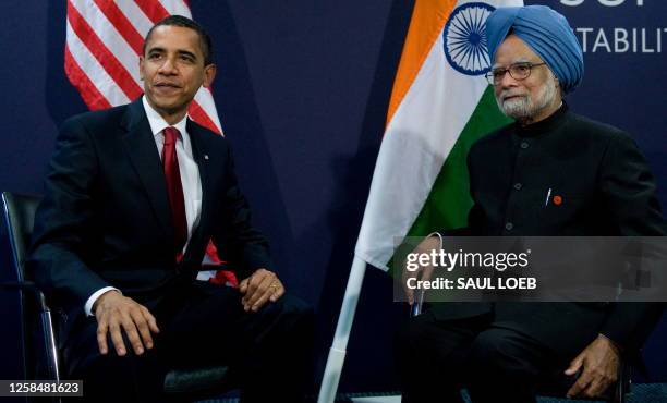 President Barack Obama sits with Indian Prime Minister Manmohan Singh during a meeting on the sideline of the G20 Summit at the ExCel Centre in...