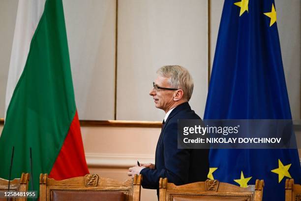 Bulgaria's new Prime Minister Nikolay Denkov of the PP-DB coalition walks after the voting for his new government at the Bulgarian Parliament...