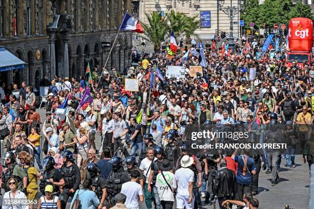 Nearly two thousand people protest in the streets on the 14th day of action after the government pushed a pensions reform through parliament without...