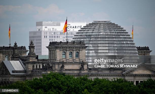 Photo taken on June 6, 2023 from a building at Potzdamer Platz Square shows The Reichstag building, seat of the German lower house of parliament...
