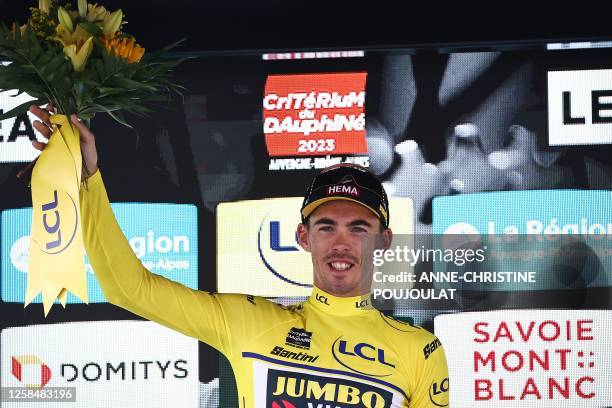 Jumbo-Visma's French rider Christophe Laporte celebrates on the podium his Yellow Jersey of Best Overall Leader, after the third stage of the 75th...