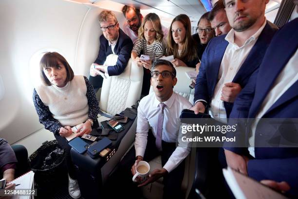 British Prime Minister Rishi Sunak holds a huddle with political journalists onboard a government plane as he heads to Washington, D.C. From the...