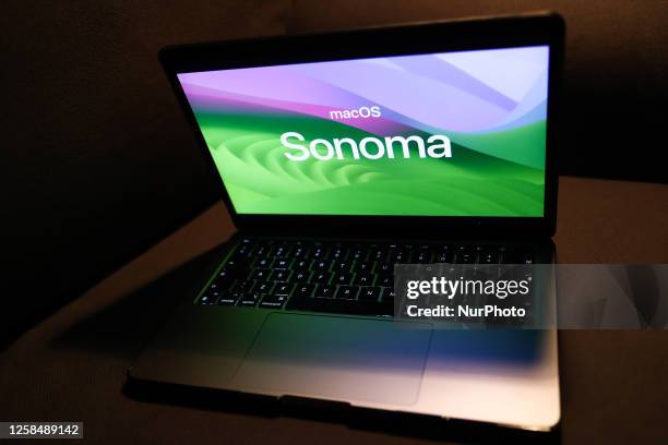 Apple macOS Sonoma logo is seen displayed on a laptop screen in this illustration photo taken in Krakow, Poland on June 6, 2023.