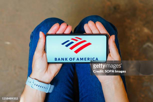 In this photo illustration, the Bank of America logo is displayed on a smartphone screen.