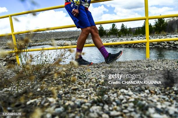 Ultramarathon runner Courtney Dauwalter cools down after her morning fitness run through the mountains near Twin Lakes, Colorado, on May 16, 2023....