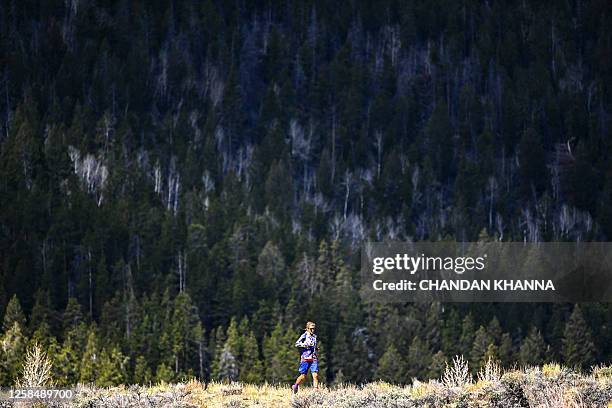 Ultramarathon runner Courtney Dauwalter runs through the mountains near Twin Lakes, Colorado, on May 16, 2023. Dauwalter sits at the apex of an elite...