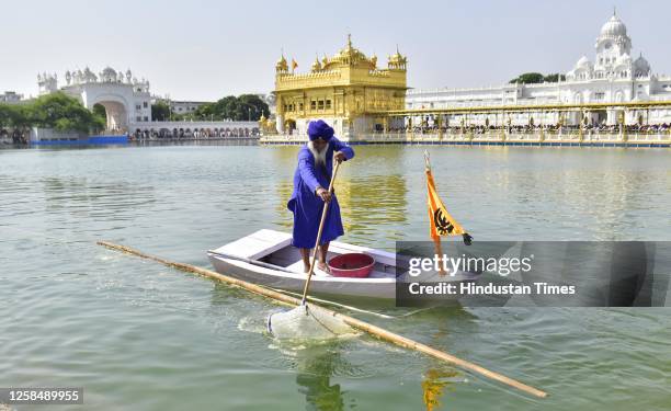 Sewadar clean the holy sarovar at Golden Temple on June 6, 2023 in Amritsar, India.