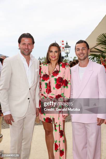 Roman Weidenfeller, Laura Wontorra and Riccardo Basile attend the Ein Herz für Kinder" Summer Reception at Wannseeterrassen Berlin on June 6, 2023 in...